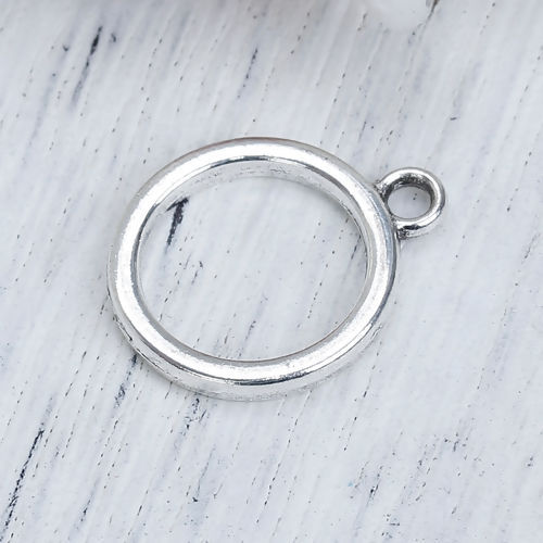 Picture of 10 PCs Zinc Based Alloy Geometric Bezel Frame Charms Pendants Antique Silver Color Round Hollow 19mm x 16mm