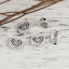 Picture of Zinc Based Alloy Spacer Beads Oval Antique Silver Color Heart " Hero " 11mm x 8mm, Hole: Approx 1.5mm, 50 PCs
