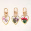 Imagen de 1 Unidad Artesanial Resina Flor Real Llaveros Chapado en Oro Multicolor Corazón